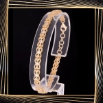 B398 Złota bransoletka. Ażurowe elementy z cyrkoniami. 585