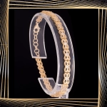 B398 Złota bransoletka. Ażurowe elementy z cyrkoniami. 585