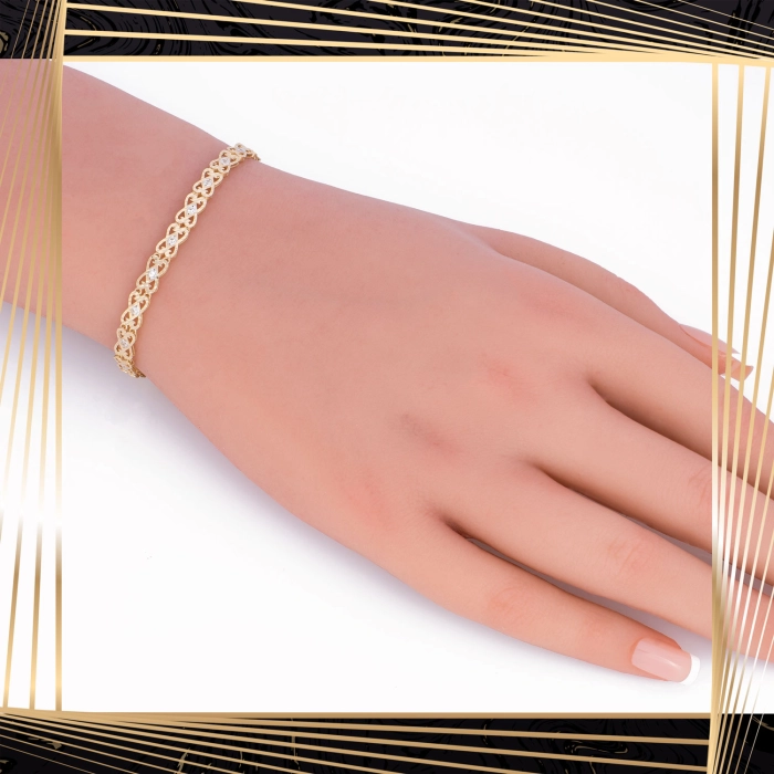 B398 Złota bransoletka. Ażurowe elementy z cyrkoniami. 585