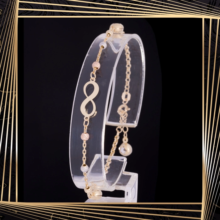 B408 Złota bransoletka. Nieskończoność z koralikami. 585