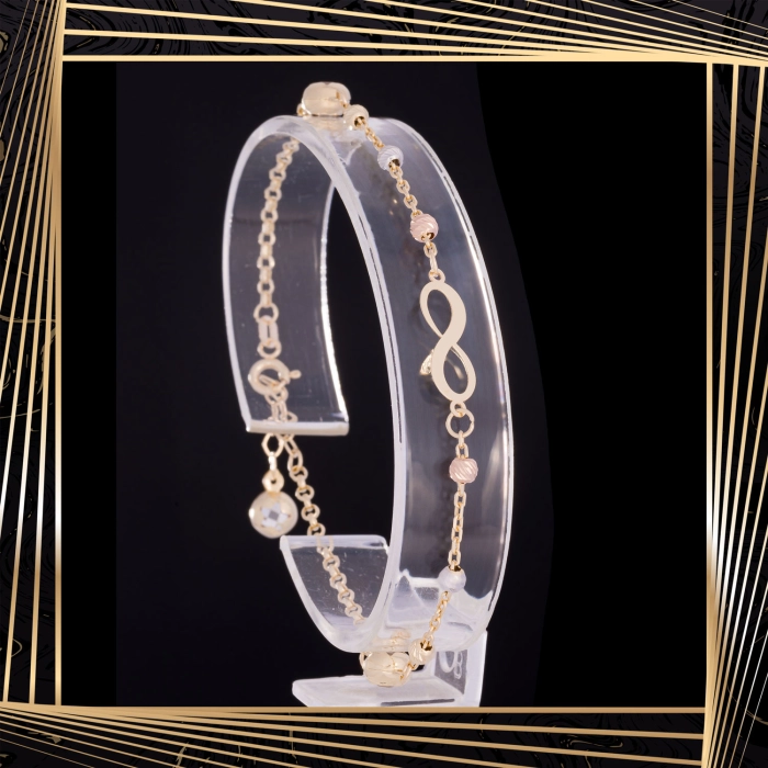 B408 Złota bransoletka. Nieskończoność z koralikami. 585