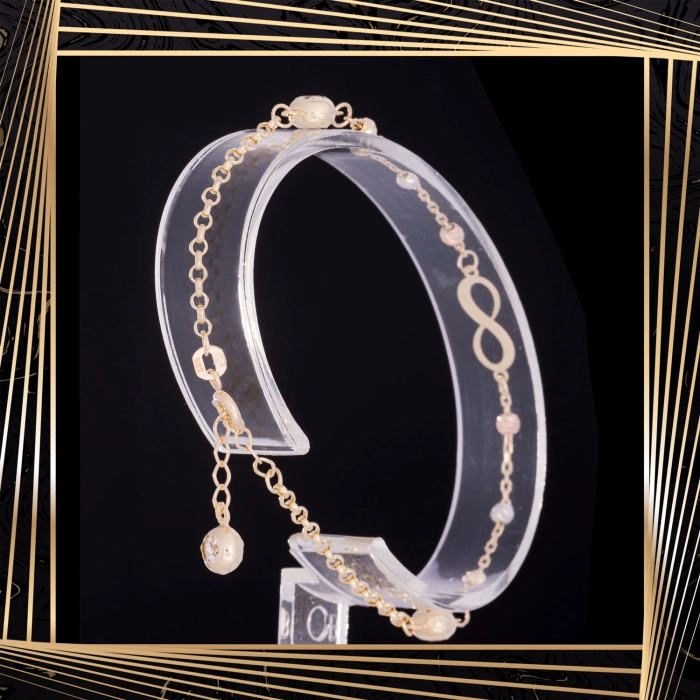 B408 Złota bransoletka. Nieskończoność z koralikami. 585