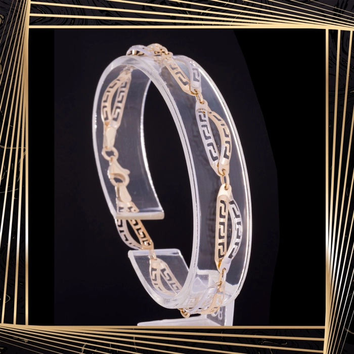 B409 Złota bransoletka. Dwukolorowe elementy z drogą grecką. 585