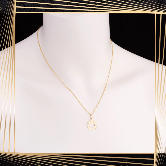 W837 Złoty wisiorek. Ażurowe złote serduszko z matowym tłem. 585