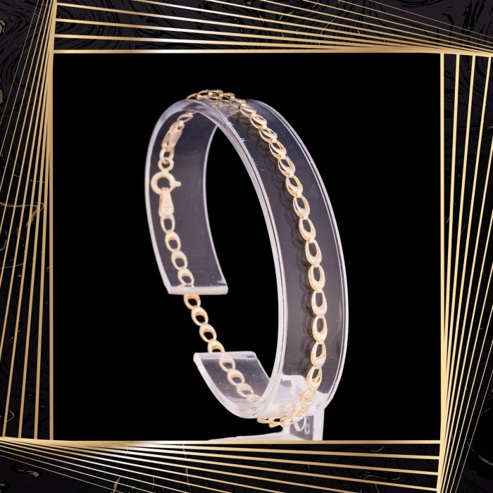 B324 Złota bransoletka z owalnymi elementami. 585